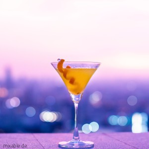 Orange Drink on a pink background.
