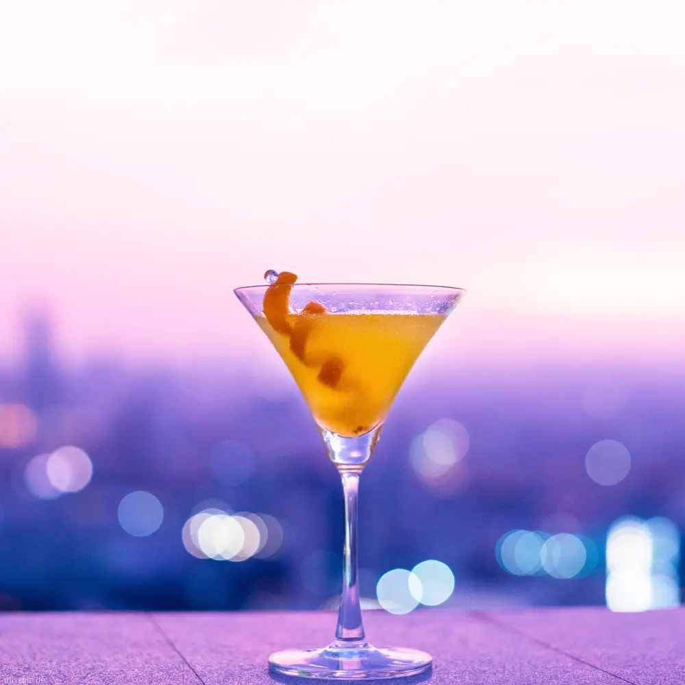 Orange Drink on a pink background.